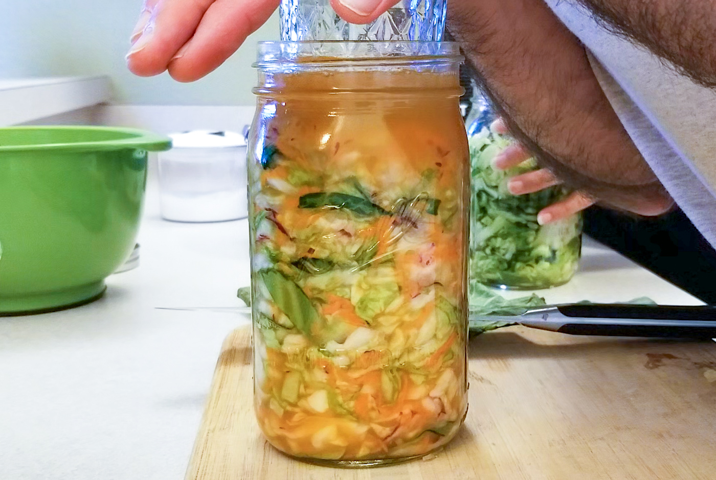 Making sauerkraut using fermentation weights or jar