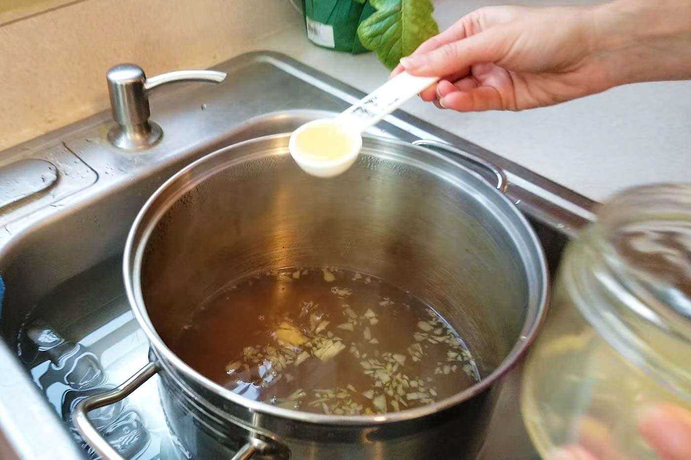 Making ginger ale wort lemon juice in sink