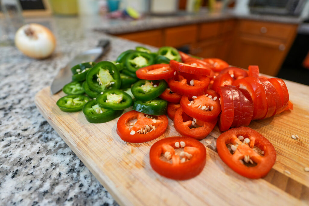 Sliced green & red jalapeno peppers chillies